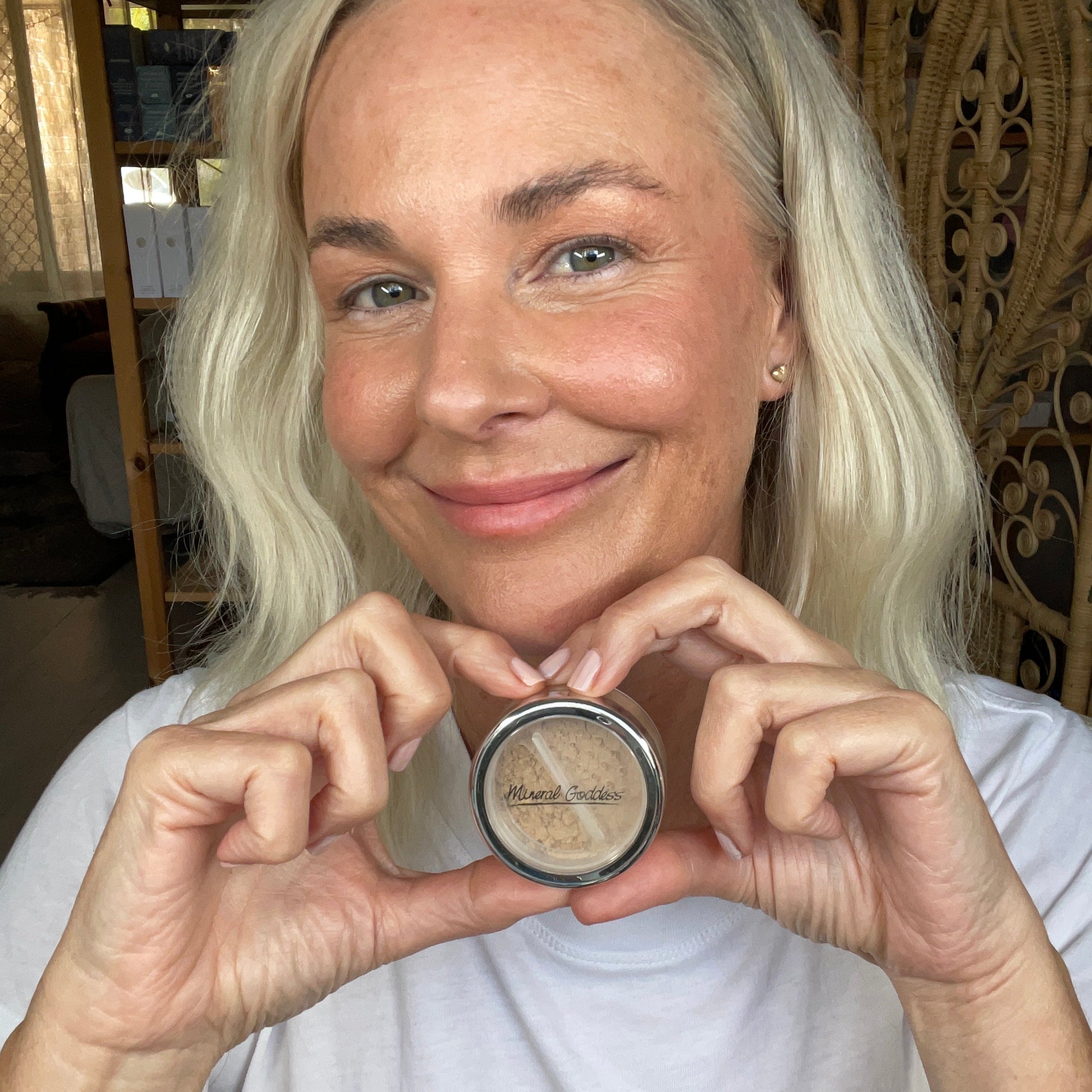 Woman holding a makeup with a blurred background